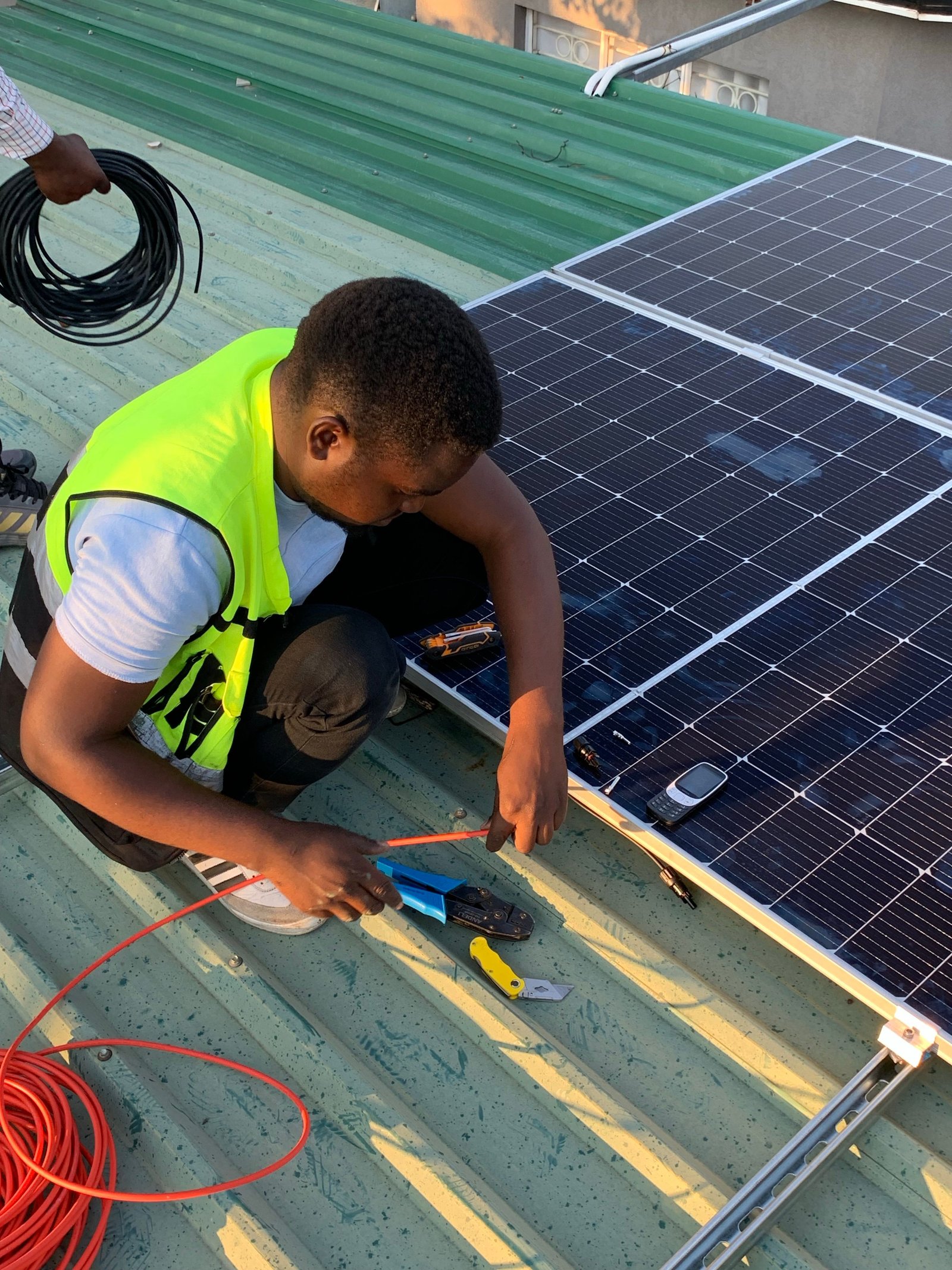DX Energy Solutions engineers monitoring live solar installations from the operations center in Benin City